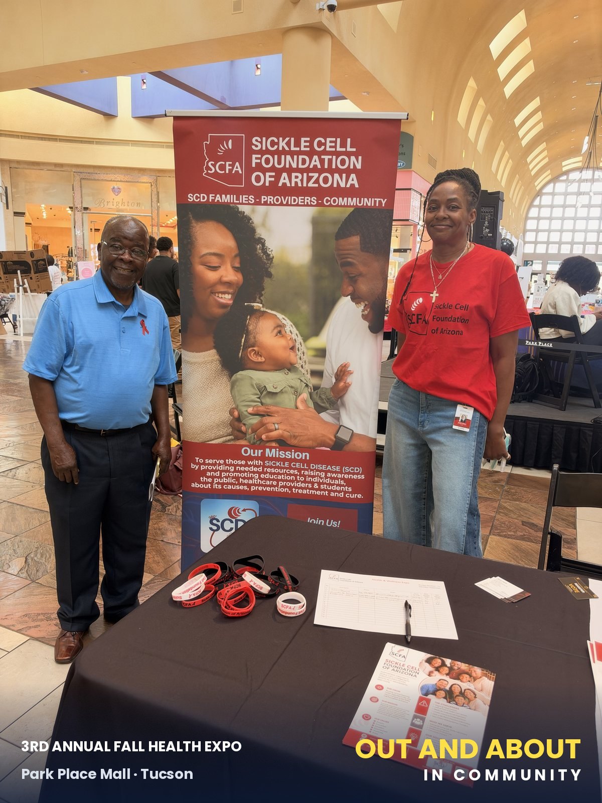 Moses Akpan and Akilah Gilbert at the SCFA banner and sign-in table.