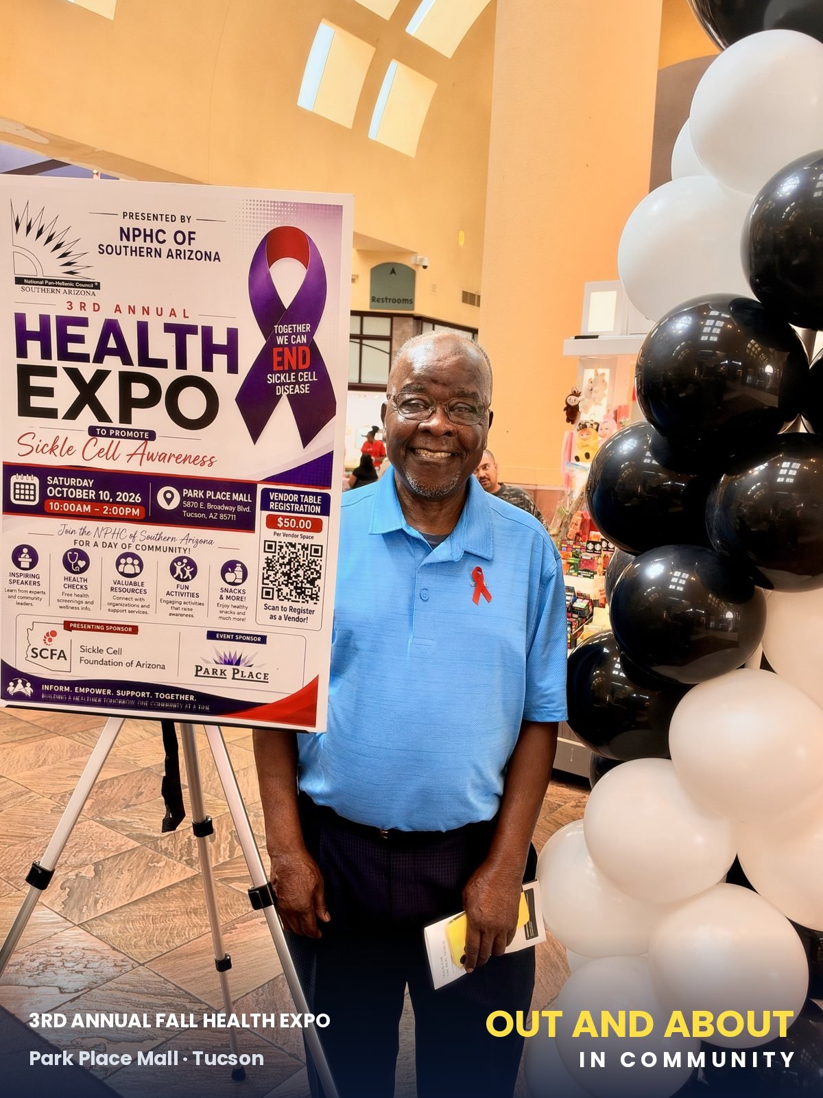 Moses Akpan beside the 3rd Annual Health Expo poster: Sickle Cell Awareness, presented by the NPHC of Southern Arizona.